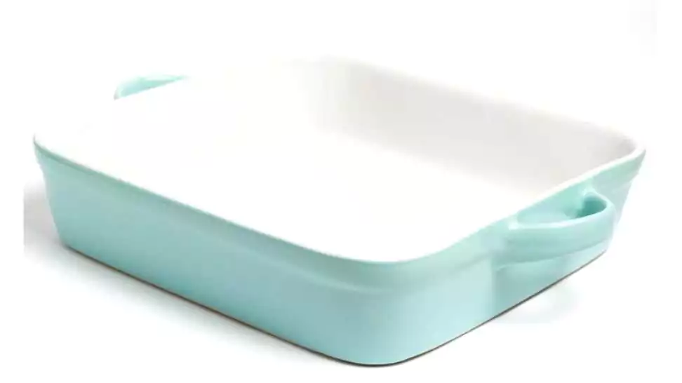 a square baking dish of turquoise color on a white background