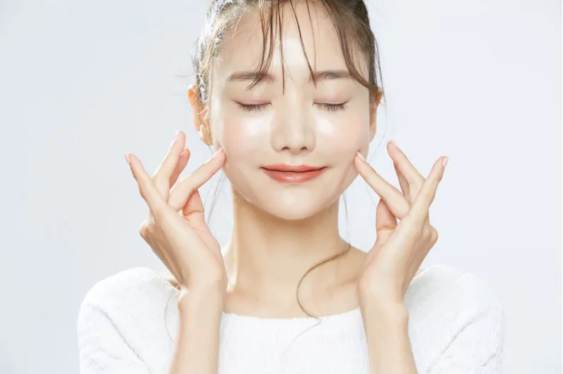 glowing face of a korean girl after toning the face