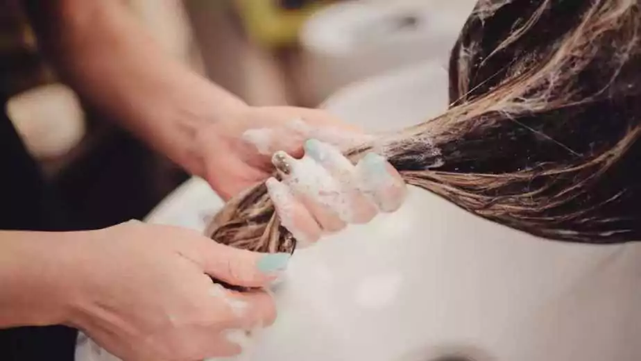a woman washing hairs