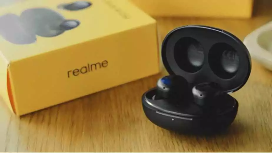 realme buds with box on a table