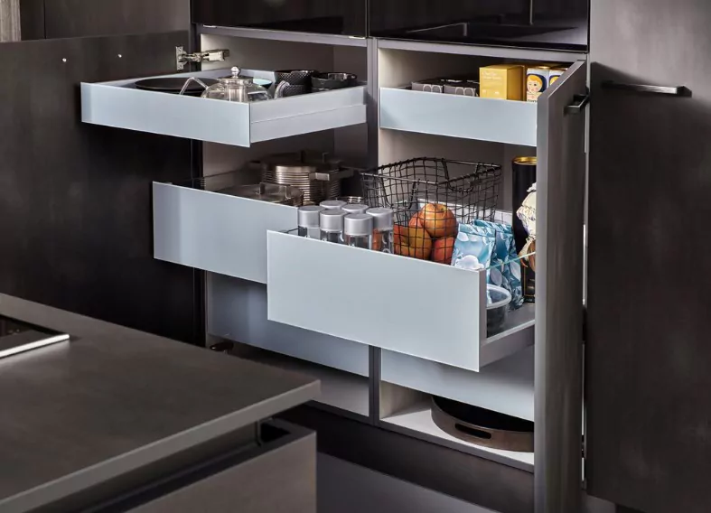 modern kitchen open drawers set of cutlery trays in kitchen drawer