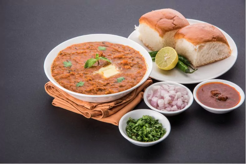 pav bhaji served with pav with onion and chutney