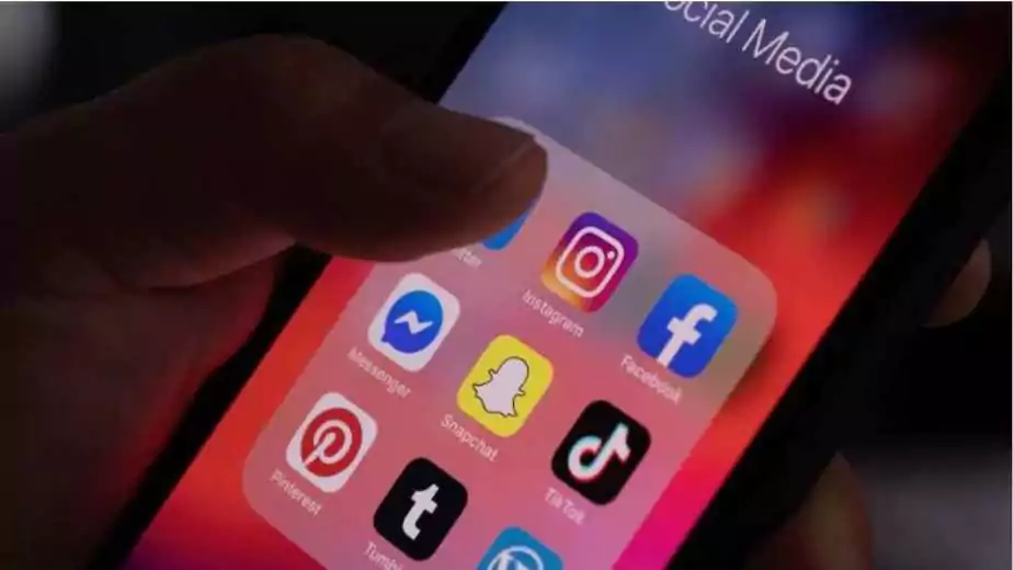 close up of smartphone display with social media application icons