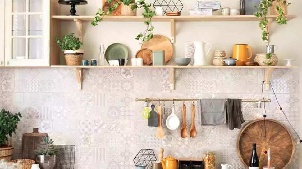 kitchen wooden shelves with various ceramic jars and cookware