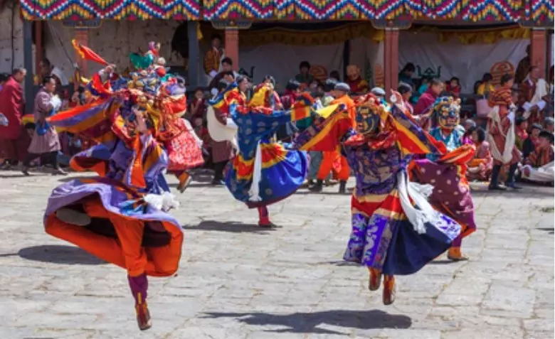 bhutanese people in beautiful traditional costume at rinpung dzong during paro tshechu
