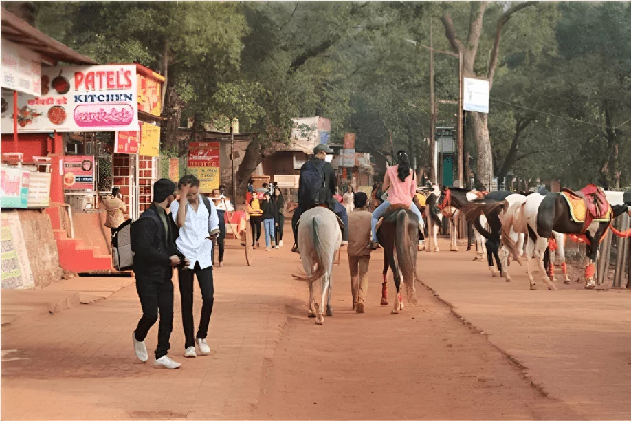 a picture of people reaching matheran by riding on horses