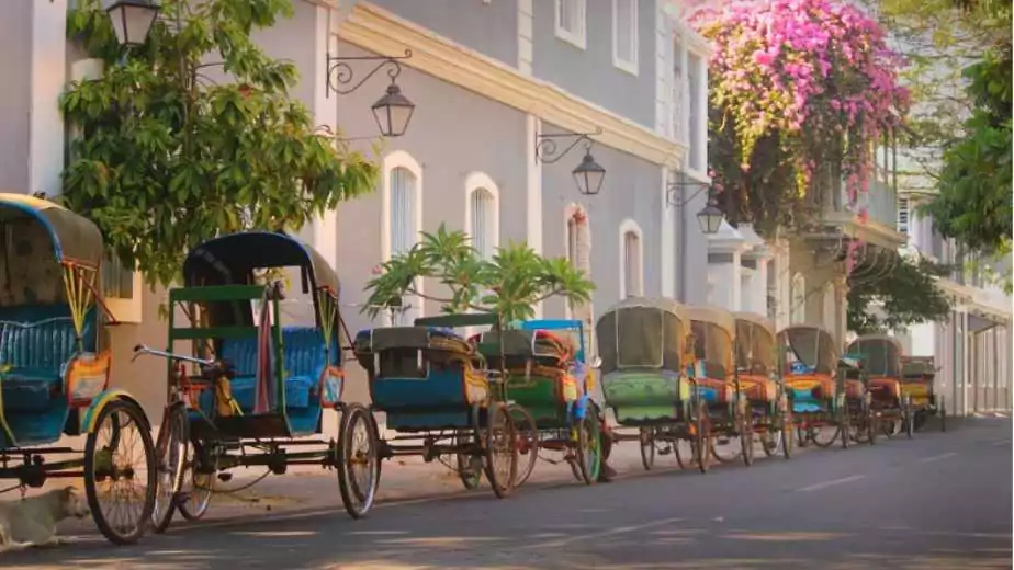 vintage tricycle carts on french style street in pondicherry