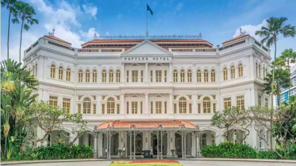 front entrance of the legendary colonial style raffles hotel in singapore