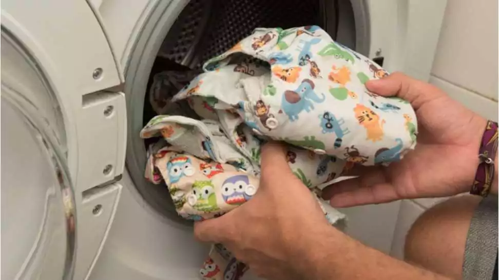 diaper in the washing machine clean clothes for a baby