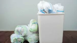 diapers waste dirty diapers in garbage pail disposing of used baby nappies