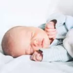 cute little newborn child sleeping peacefully