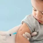 doctor vaccinating baby in hospital