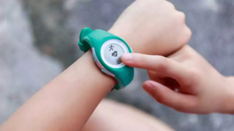 girl using smartwatch touching button and touchscreen on active sports