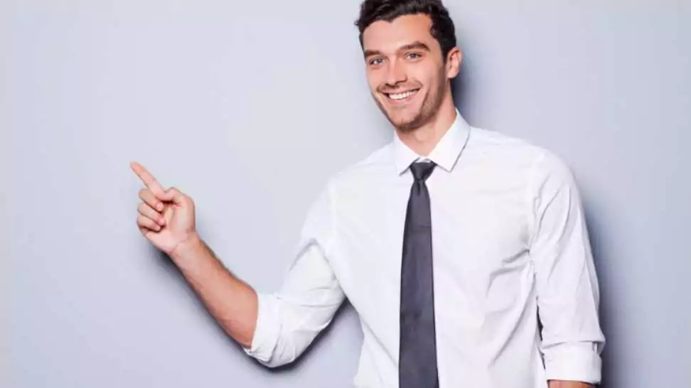 happy young man in shirt and tie
