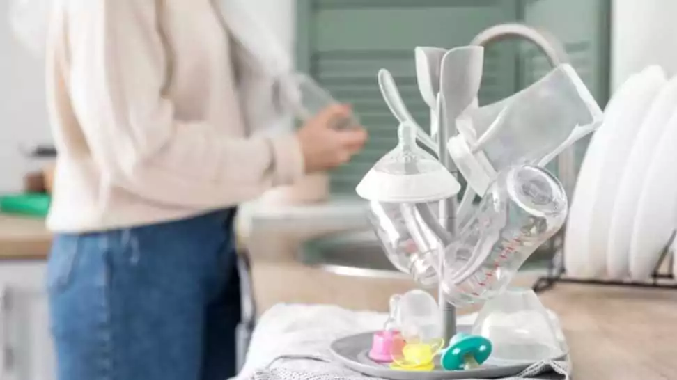 drying rack for baby bottles on table in kitchen