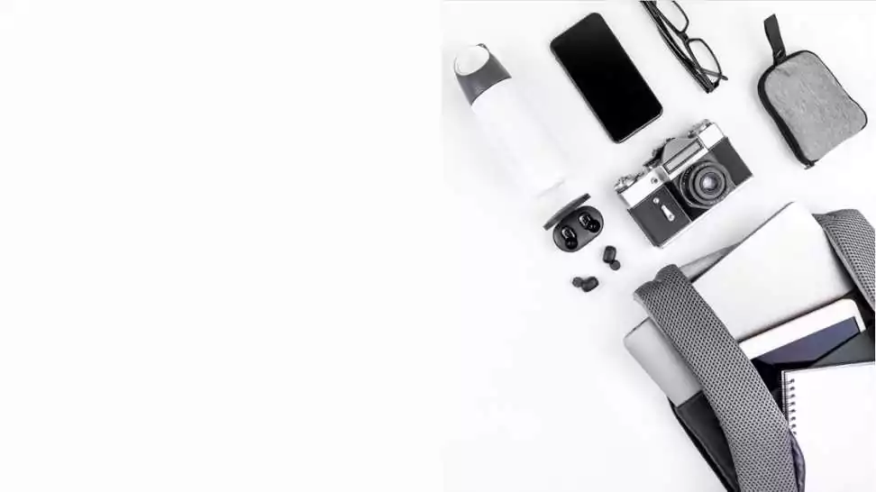 creative top view flat lay of open backpack with laptop and tablet inside mobile phone copy space white background minimal style