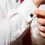 groom buttons on a white shirt cufflinks