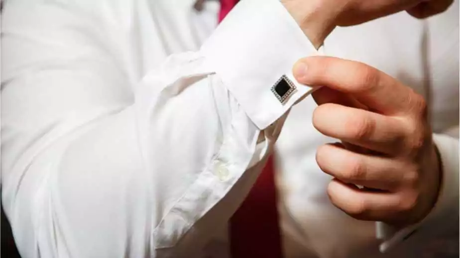 groom buttons on a white shirt cufflinks
