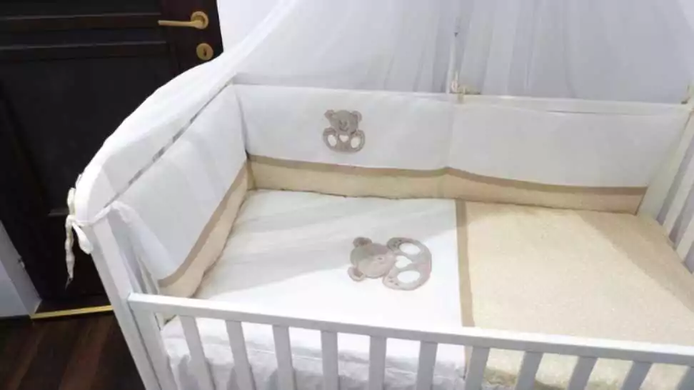 white wooden baby crib child's bed