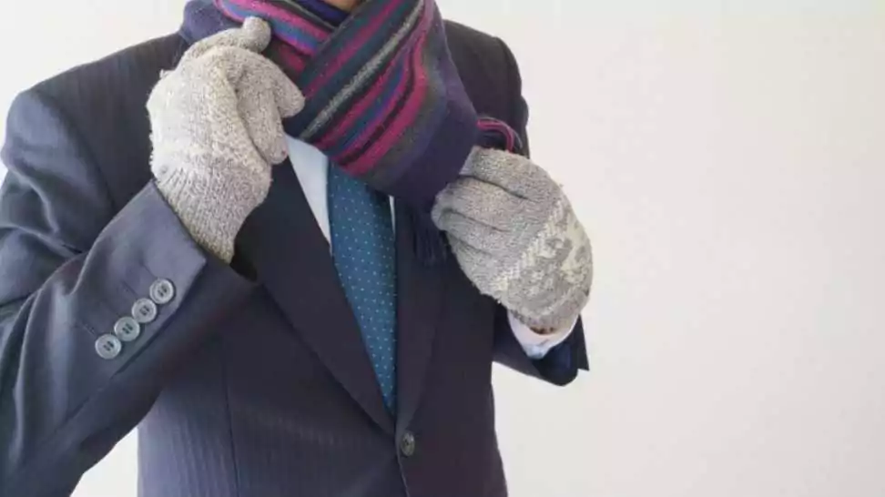 a businessman who wears a scarf in winter