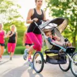 active mother jogging with her baby in jogging stroller