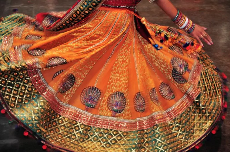 abstract of dancing girl colourful costume with motion effect during navratri festival celebration