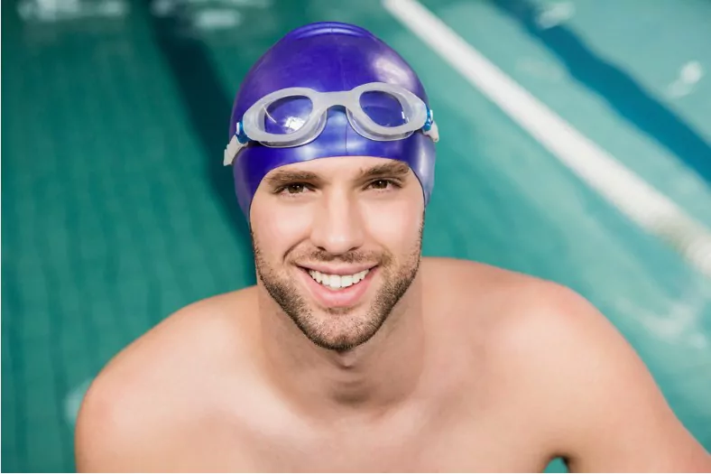 man wearing swimming cap