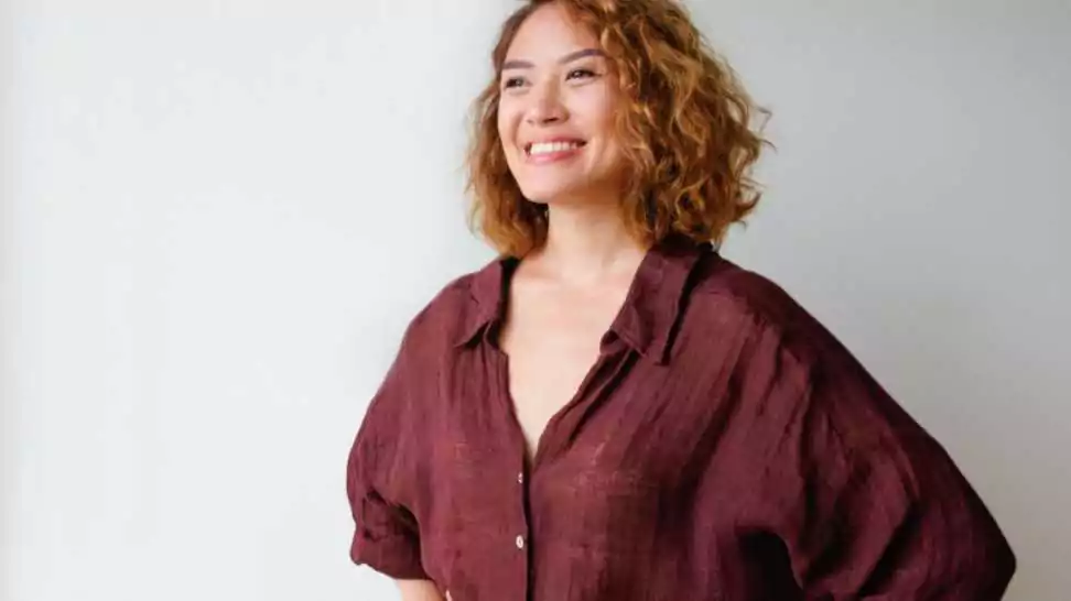 portrait of happy woman wearing oversized shirt