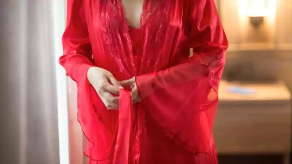 woman wearing a red nightgown