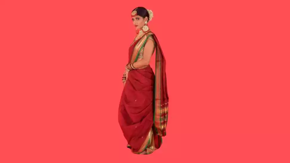 beautiful portrait of beauty and fashion model draped in red coloured nauvari saree