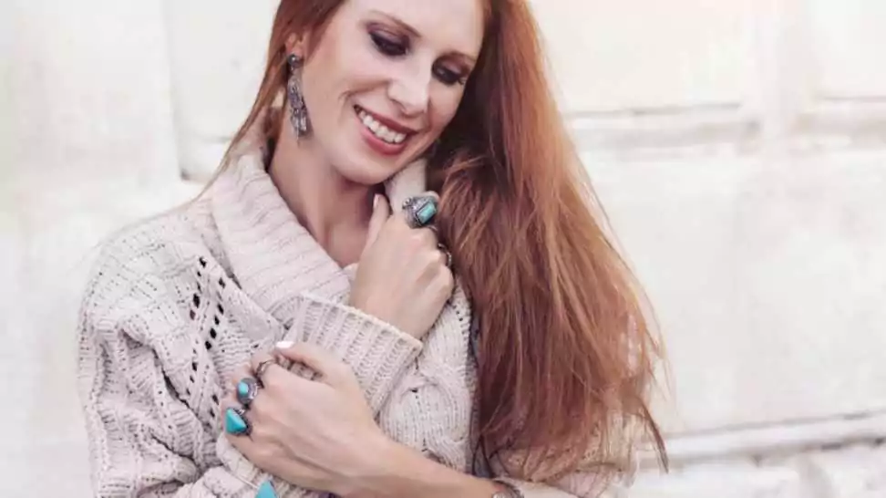 beautiful woman wearing warm woollen sweater and fashion jewellery